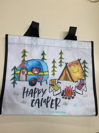 Tote bag with camping-themed design and 'Happy Camper' text on a beige background