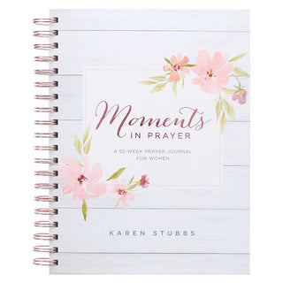 Prayer journal titled 'Moments in Prayer' with floral design on a white background