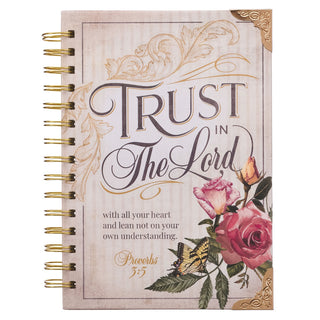 Notebook with floral design and 'Trust in The Lord' text on a white background