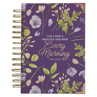 Notebook with floral design and Bible verse text on a purple background