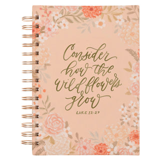 Notebook with floral design and 'Consider how the wildflowers grow' text on a white background