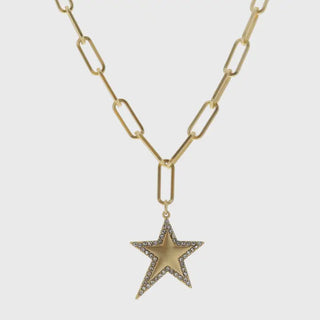 Gold star pendant on a gold chain necklace