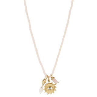 Necklace with sun and eye pendant on a gold chain