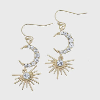 Gold earrings with moon and sun designs 