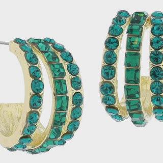 Gold hoop earrings with green gemstones