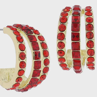 Gold hoop earrings with red gemstones