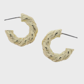 Gold hoop earrings with textured design 