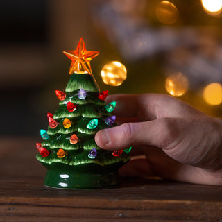 Ceramic Christmas tree with led lights for ornaments.