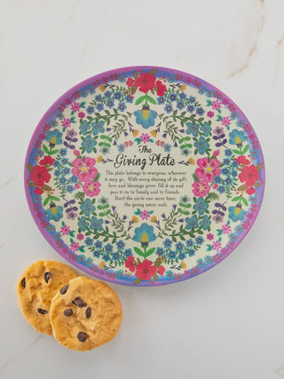 Decorative plate with floral design and text