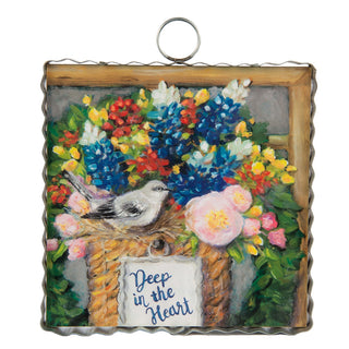 Decorative wall art with a bird, flowers, and 'Deep in the Heart' text on a white background.