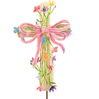 Decorative wooden cross with a pink bow and colorful flowers on a white background