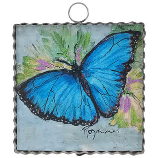 Decorative wall art with a blue butterfly on a floral background