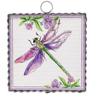 Decorative wall hanging with a dragonfly and floral design on a white background