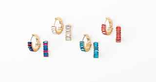 Set of colorful hoop earrings on a white background
