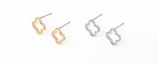 Pair of gold and silver clover-shaped earrings on a white background