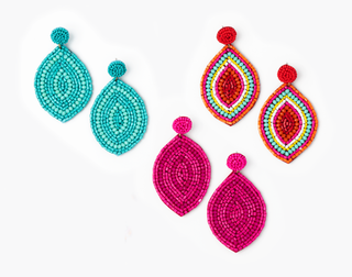 Colorful beaded earrings on a white background