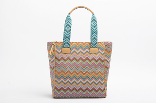 Colorful zigzag patterned tote bag with a white background