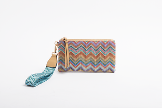 Colorful zigzag patterned pouch with a matching strap on a white background