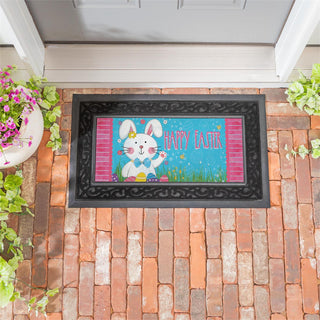 Decorative doormat with Easter design featuring a rabbit and 'Happy Easter' text on a brick patio.