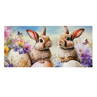 Two rabbits sitting on Easter eggs with flowers and butterflies in the background