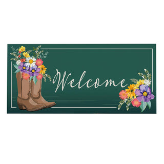 Welcome sign with cowboy boots and flowers on a green background