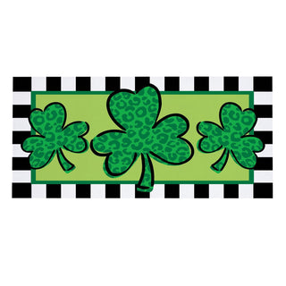 Three green shamrocks on a green banner with black and white checkered border