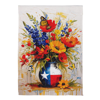Festive towel with a colorful floral arrangement and Texas flag vase on a white background