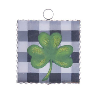  green four-leaf clover design on a checkered background