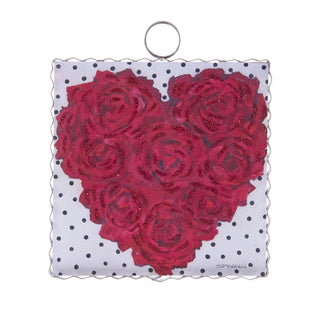 Round Top Charm Heart-shaped arrangement of red roses on a white background with black polka dots