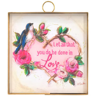 Decorative wall art with birds, flowers, and 'Let all that you do be done in Love' text.