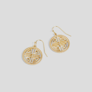Gold hoop earrings with intricate designs on a light gray background