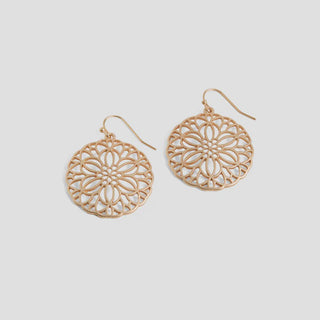 Gold floral-patterned earrings on a white background