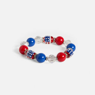 Bracelet with red, blue, and white beads on a light gray background