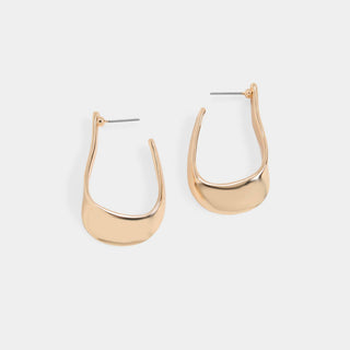A pair of modern, polished gold-toned huggie hoop earrings with a flat, rounded bottom edge and post-back closures, shown on a light gray background.