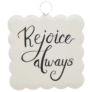 Decorative sign with 'Rejoice always' text on a white background