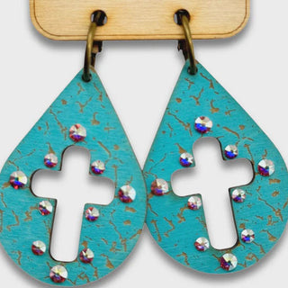 Turquoise earrings with cross design and rhinestones on a Pink Panache card.
