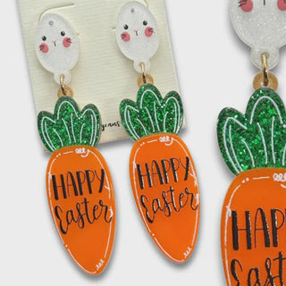 Easter-themed earrings with carrots and eggs on a POSH Jewelry Co. card.